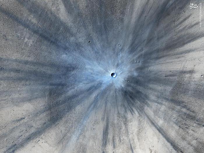 An impact crater on Mars is seen in an image taken by Orbiter.